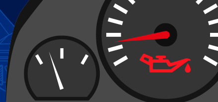 Immagine del cruscotto di un'auto con la spia dell'olio motore accesa